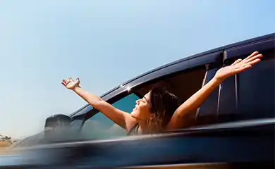 Photo of a woman feeling free while renting a car in the Canary Islands